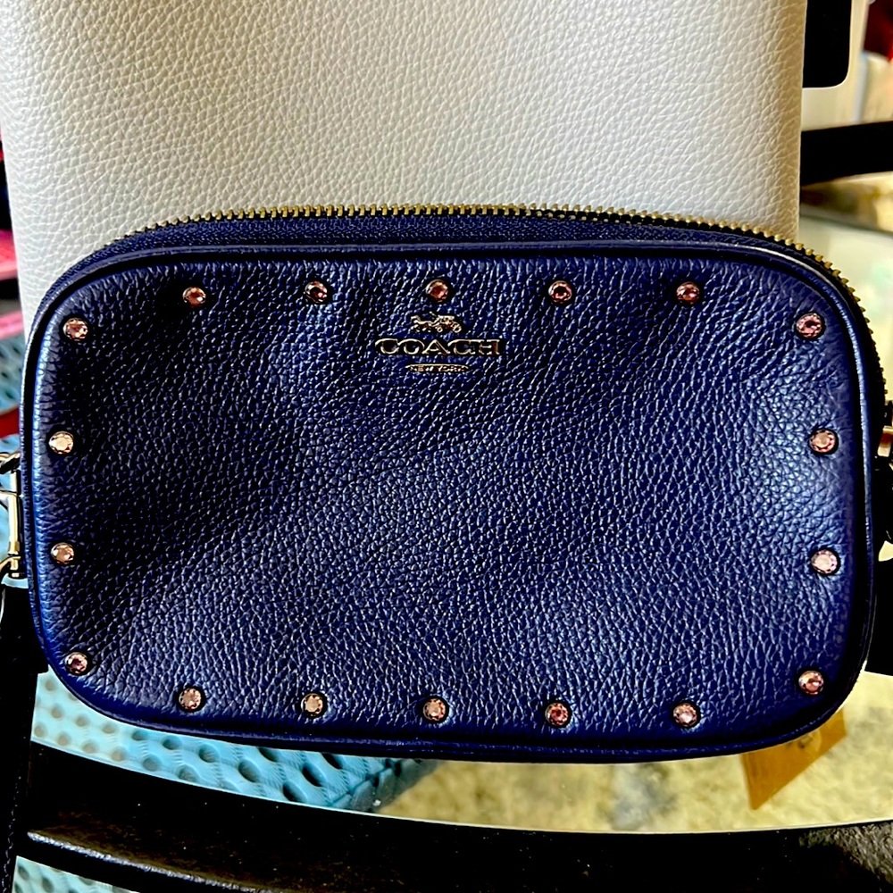 COACH navy blue, double sided with wrist band.
